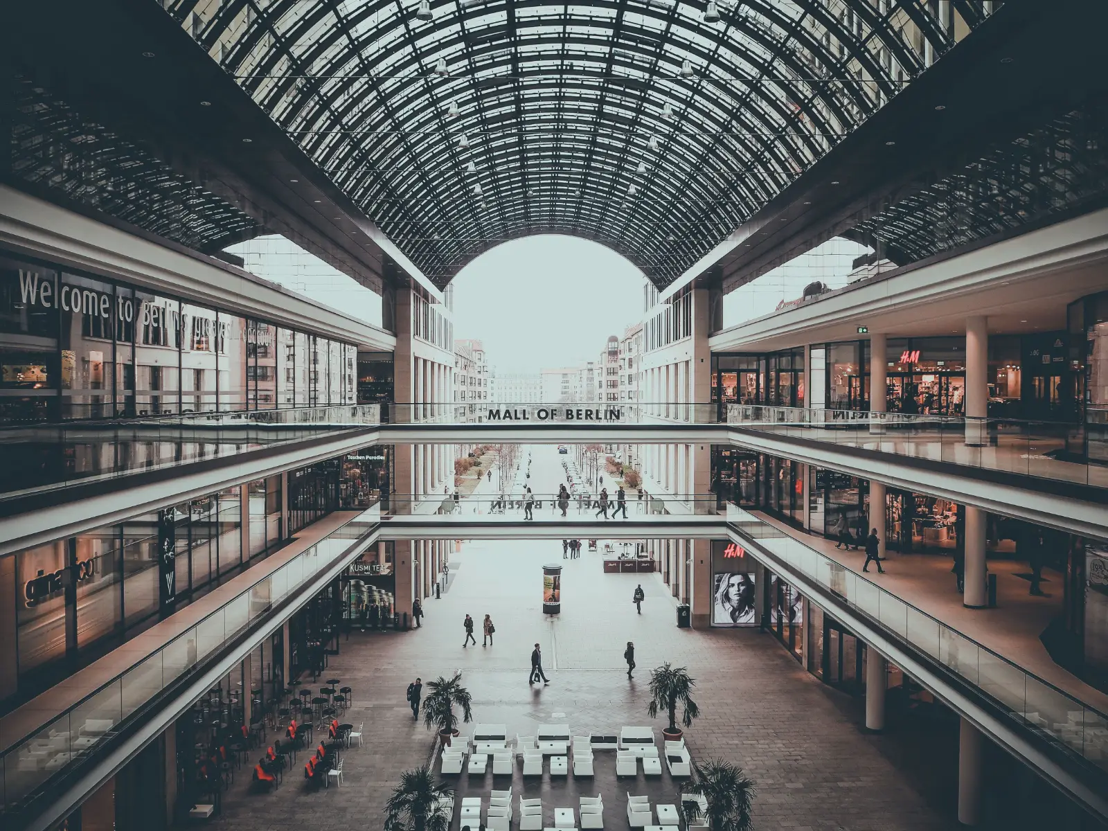 A glass-roofed hall seen from above.