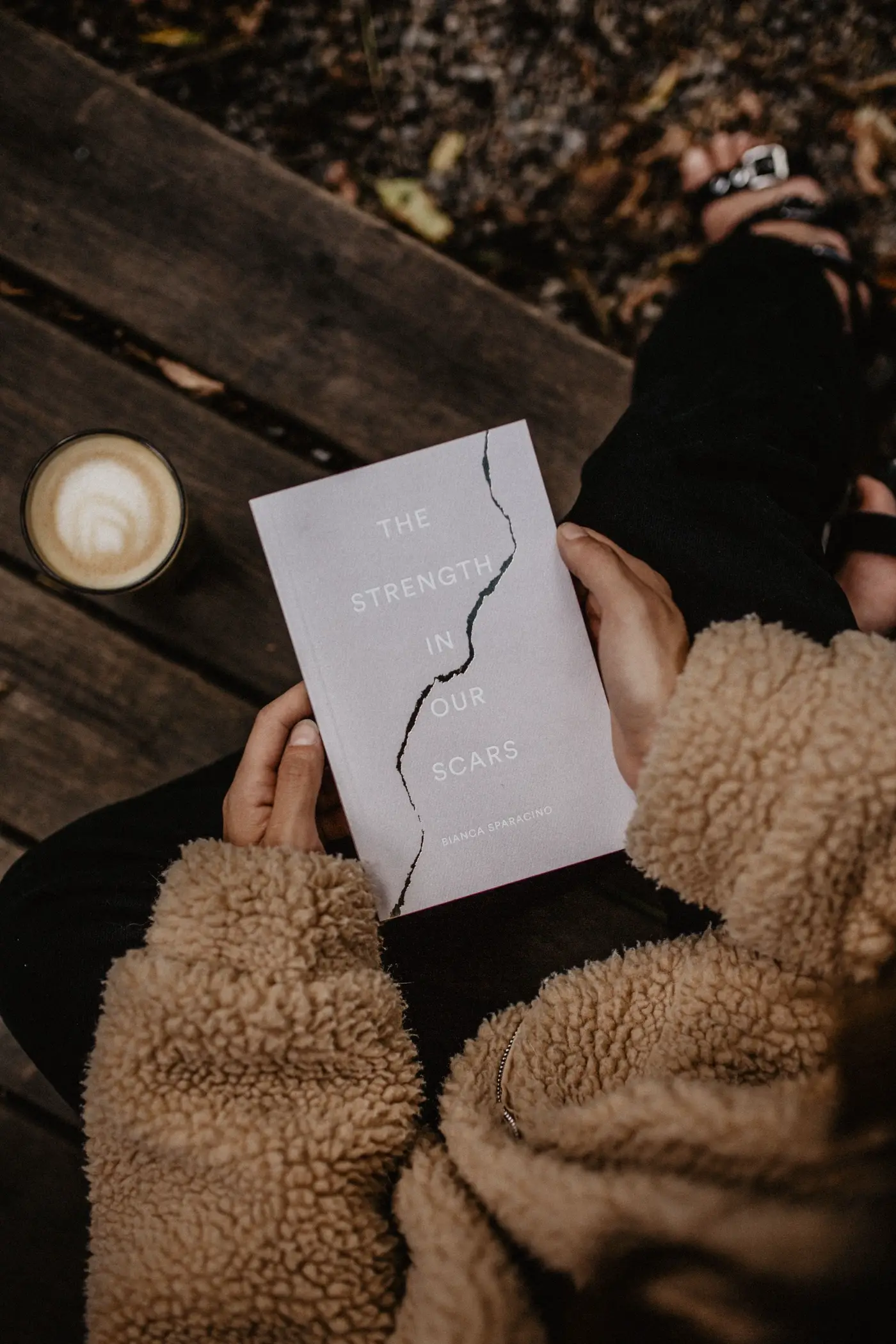 A notebook open on an outdoor table.